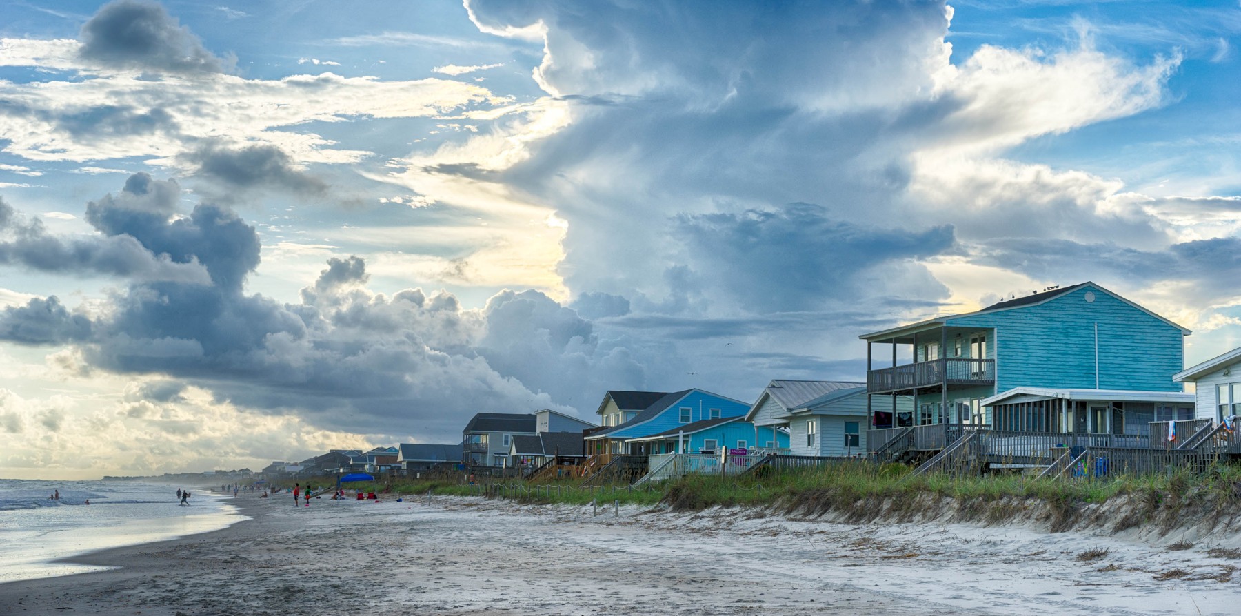 Oak Island shoreline beneath evening clouds; photographed August 4, 2016.